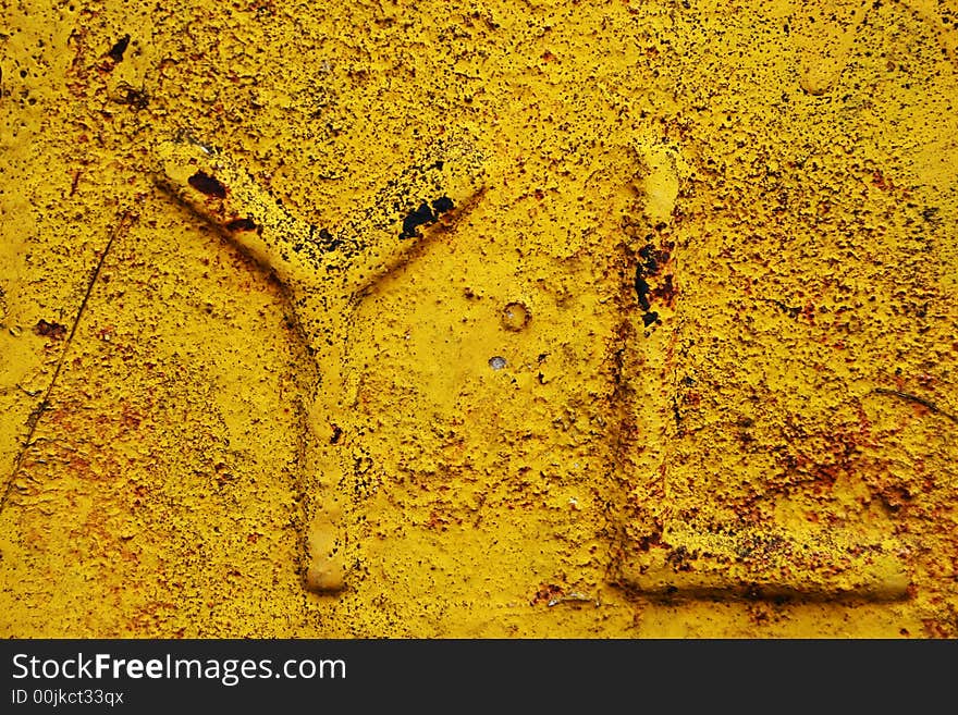 YL alphabet grunge on yellow paint texture