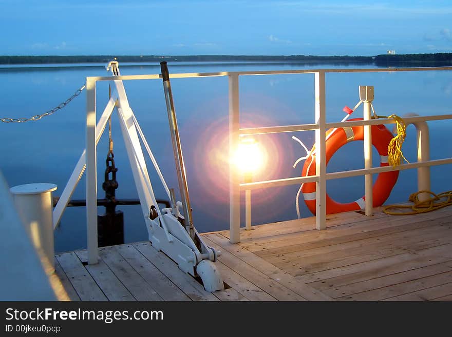 Anchor, lamp and life buoy on a lower deck
