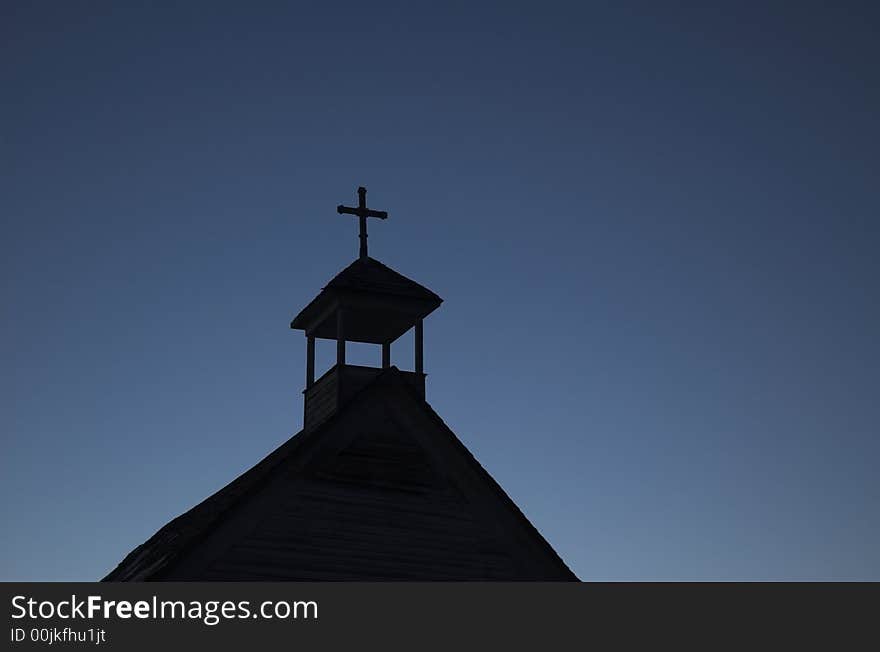 An old unused church located in the badlands of Alberta at sunset. An old unused church located in the badlands of Alberta at sunset.