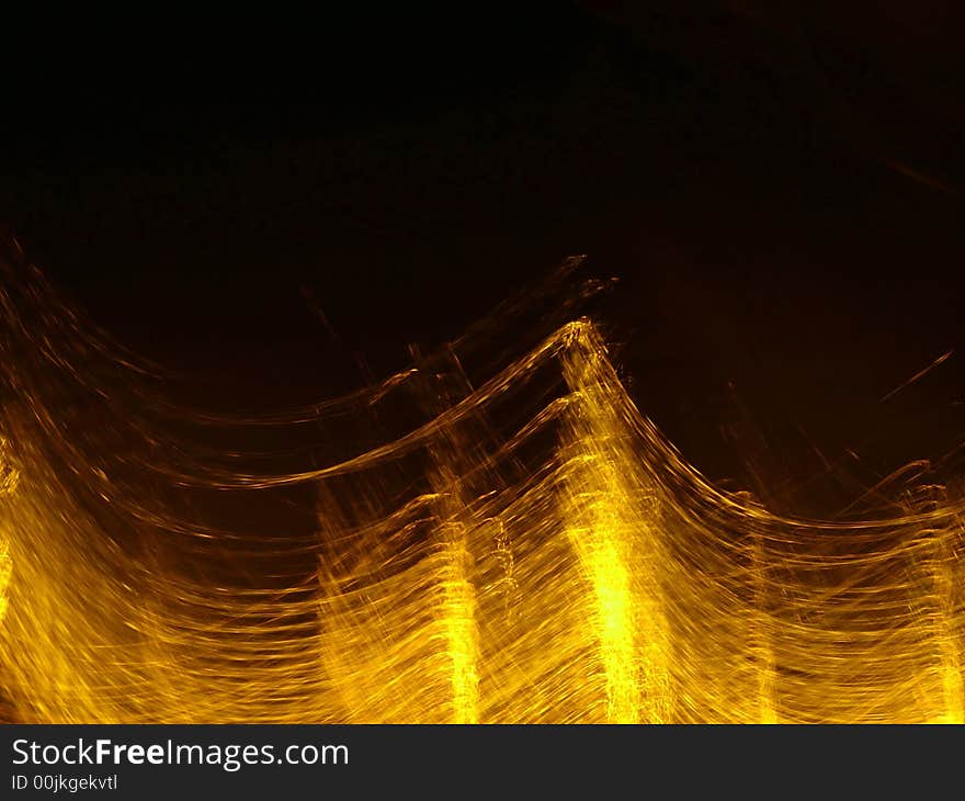 Waves of gold light against dark background. Waves of gold light against dark background