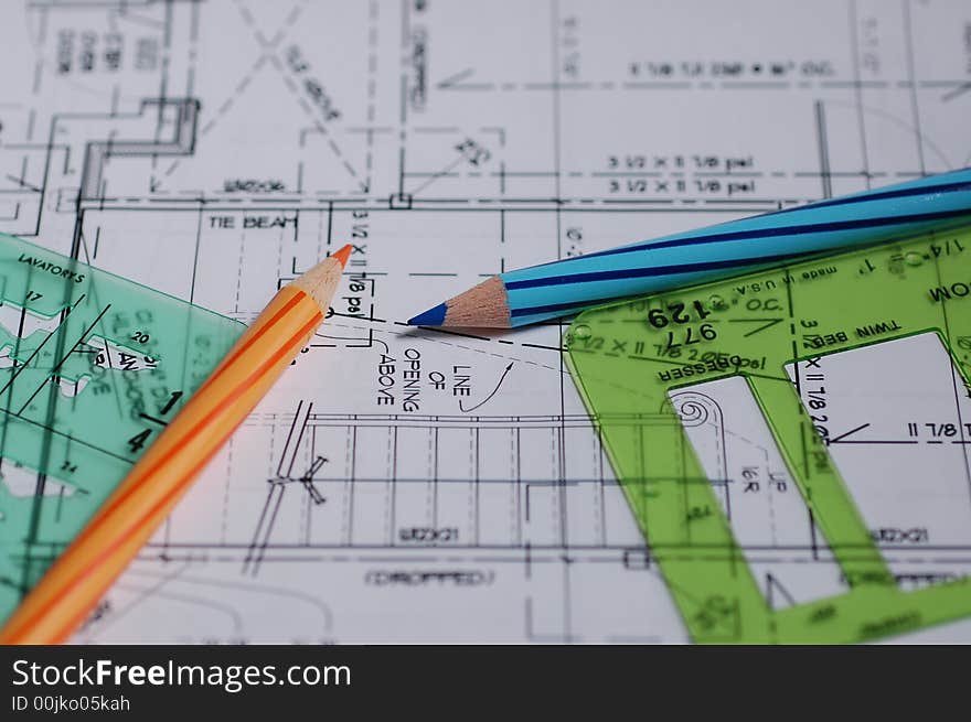 Architectural drawings with templates and pencils.