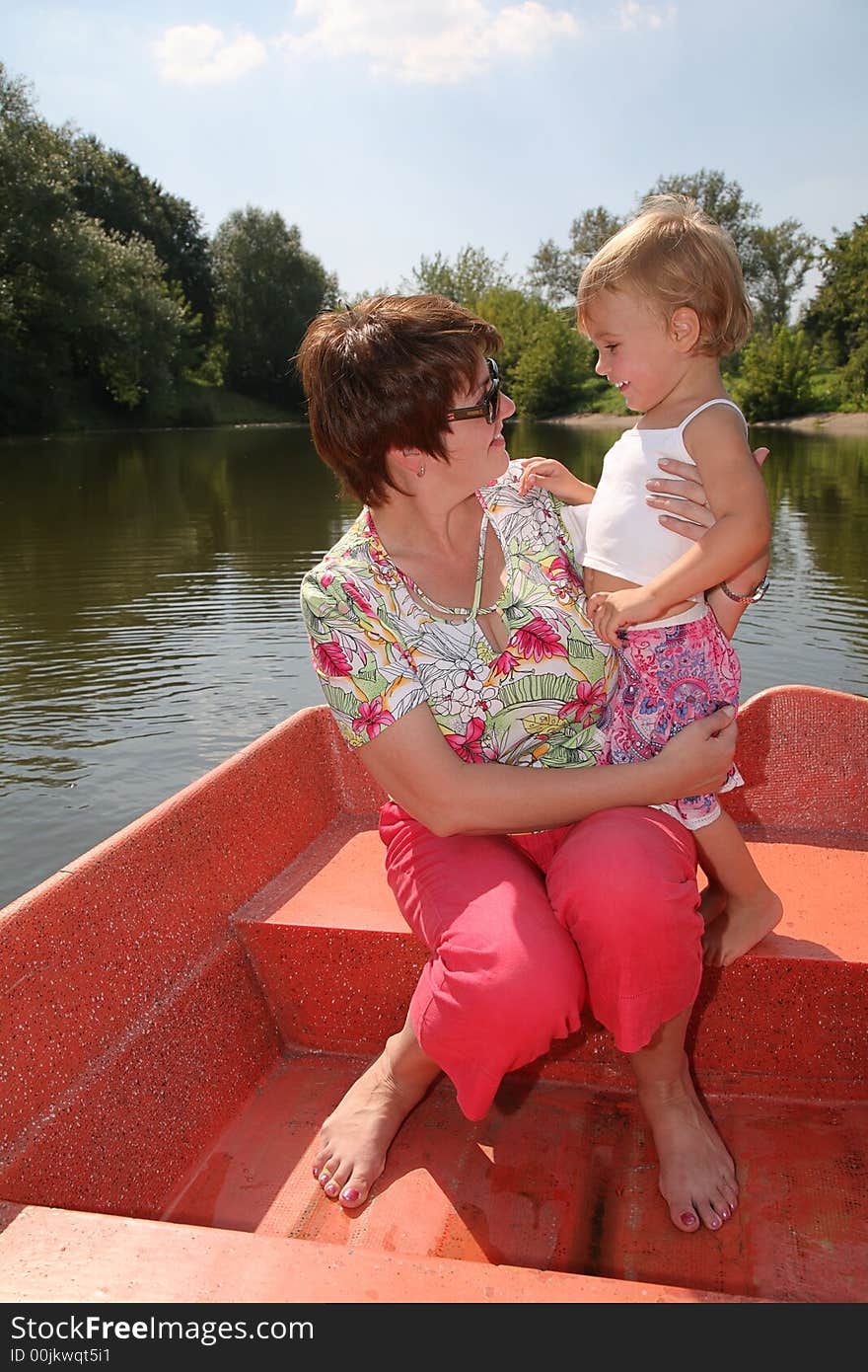 Woman with the girl in the boat