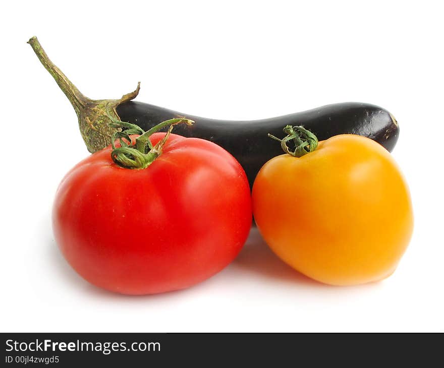 Eggplant with tomatoes on a white studio background