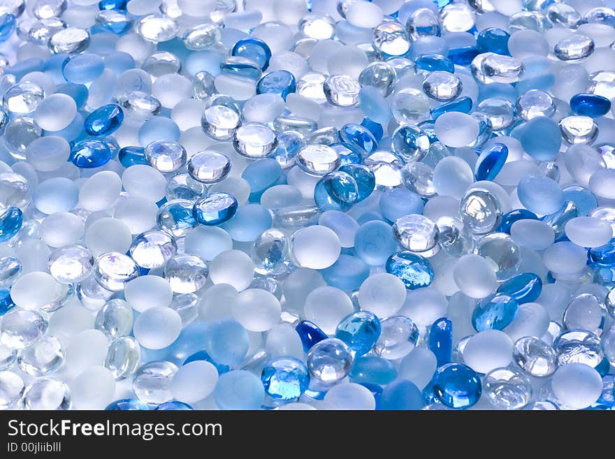 Scattering of small glass white and blue balls. Scattering of small glass white and blue balls