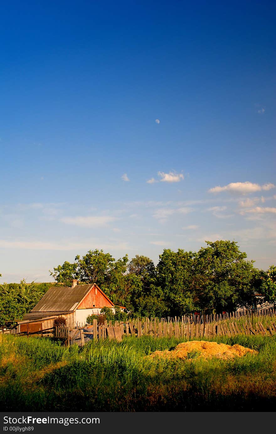 Rural landscape with  house, autumn evening