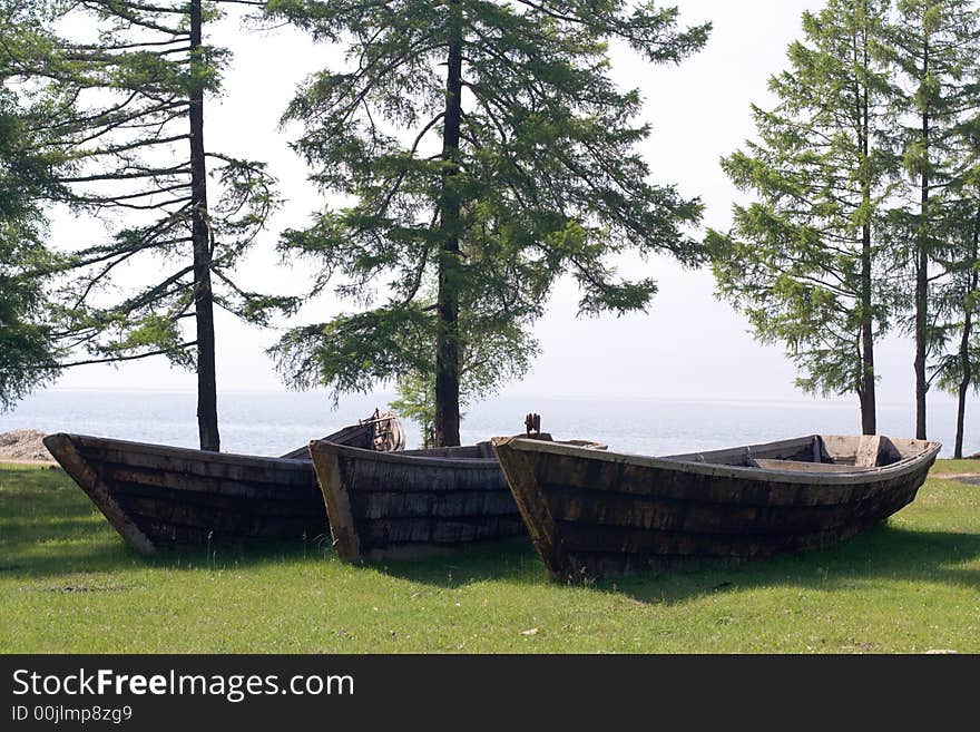 Old wooden fishing boats on the Baikal lakeside