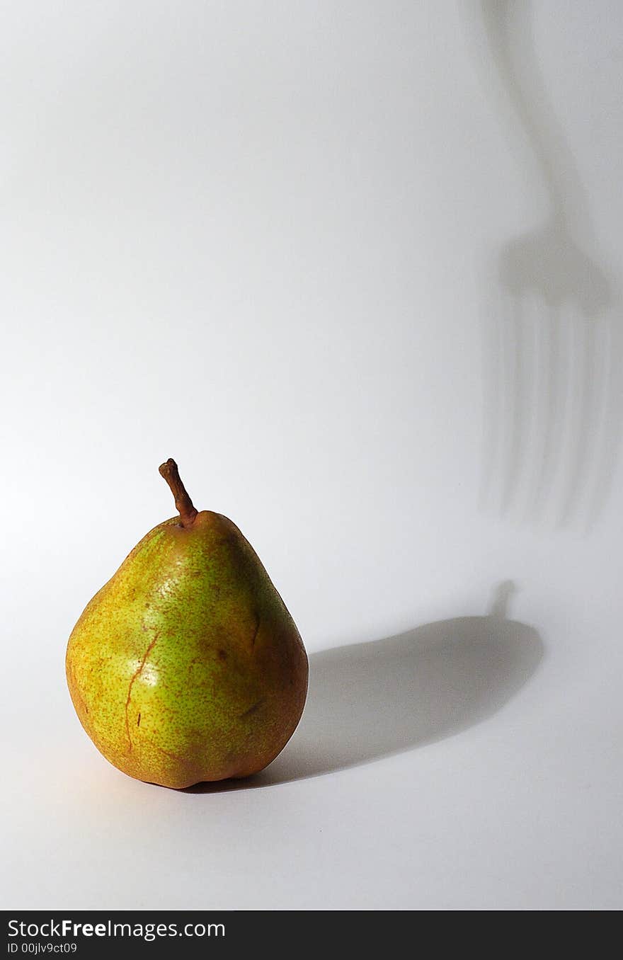 The Pear and shadow from fork