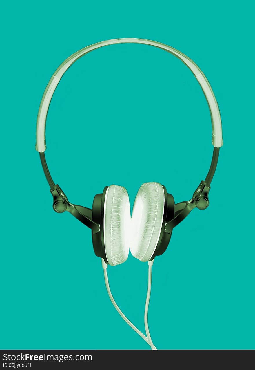 Modern headphones inverted isolated on green