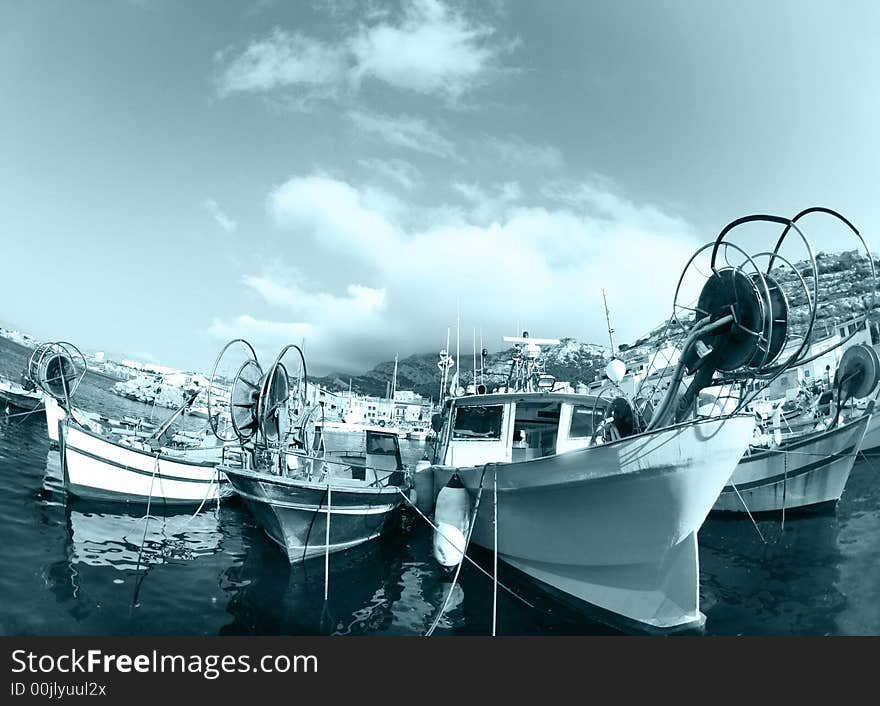 Pretty fishing boats shot with fisheye lens in marseille, france. Pretty fishing boats shot with fisheye lens in marseille, france