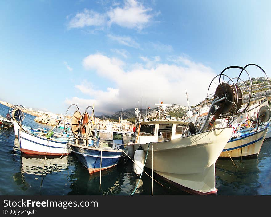 Pretty fishing boats shot with fisheye lens in marseille, france. Pretty fishing boats shot with fisheye lens in marseille, france