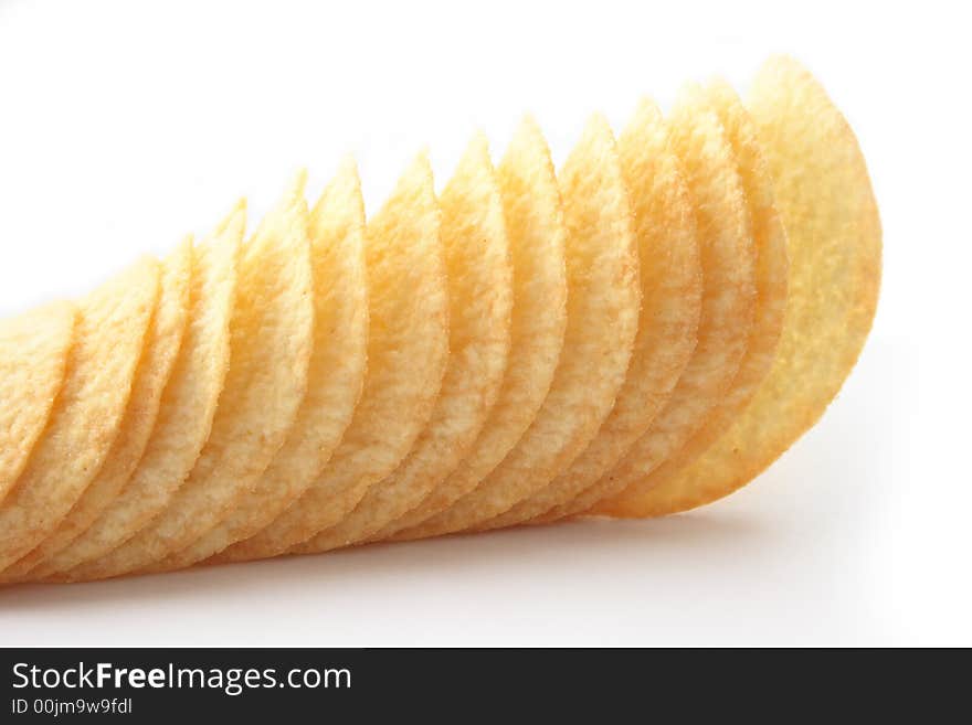 On a photo potato chips. The photo is isolated.