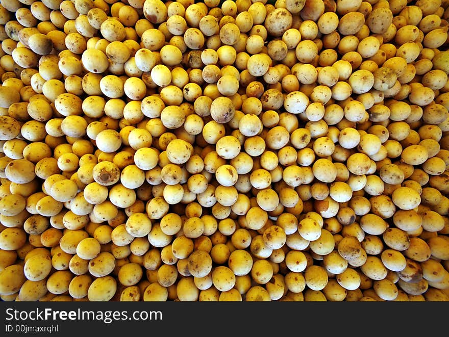 Stacks of tropical fruits called langsat. Stacks of tropical fruits called langsat.