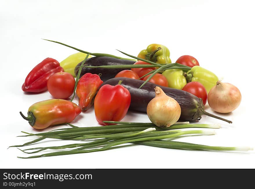 Eggplant, pepper, onions and tomatoes on a white background