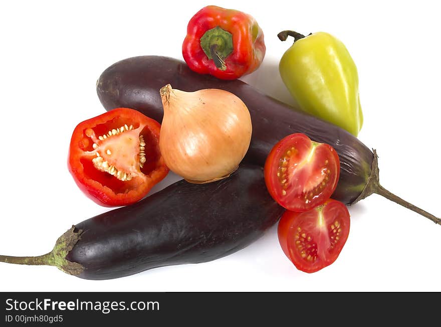 Eggplant, pepper, onions and tomatoes on a white background