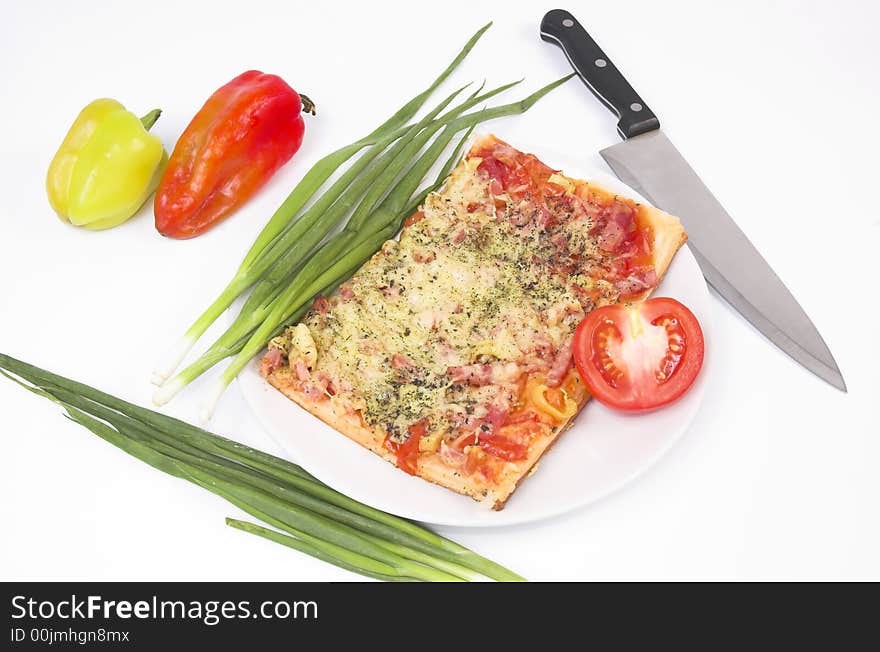 Salad, vegetables and pizza on a white background