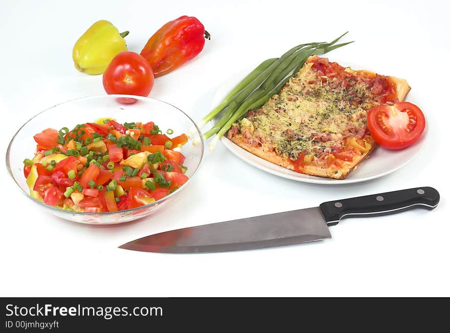 Salad, vegetables and pizza on a white background