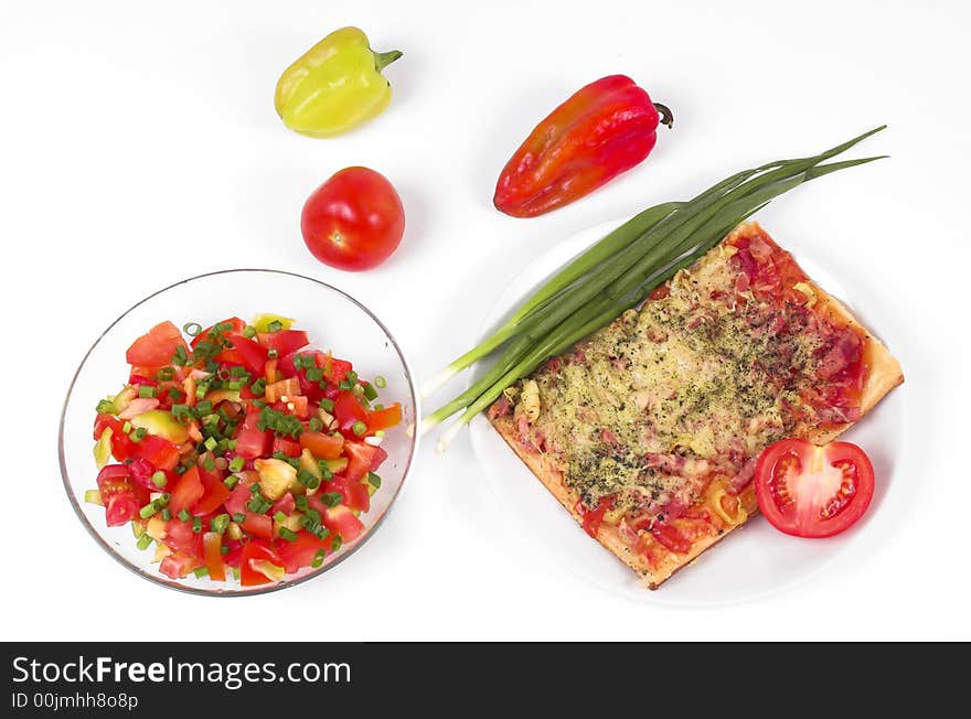 Salad, vegetables and pizza on a white background