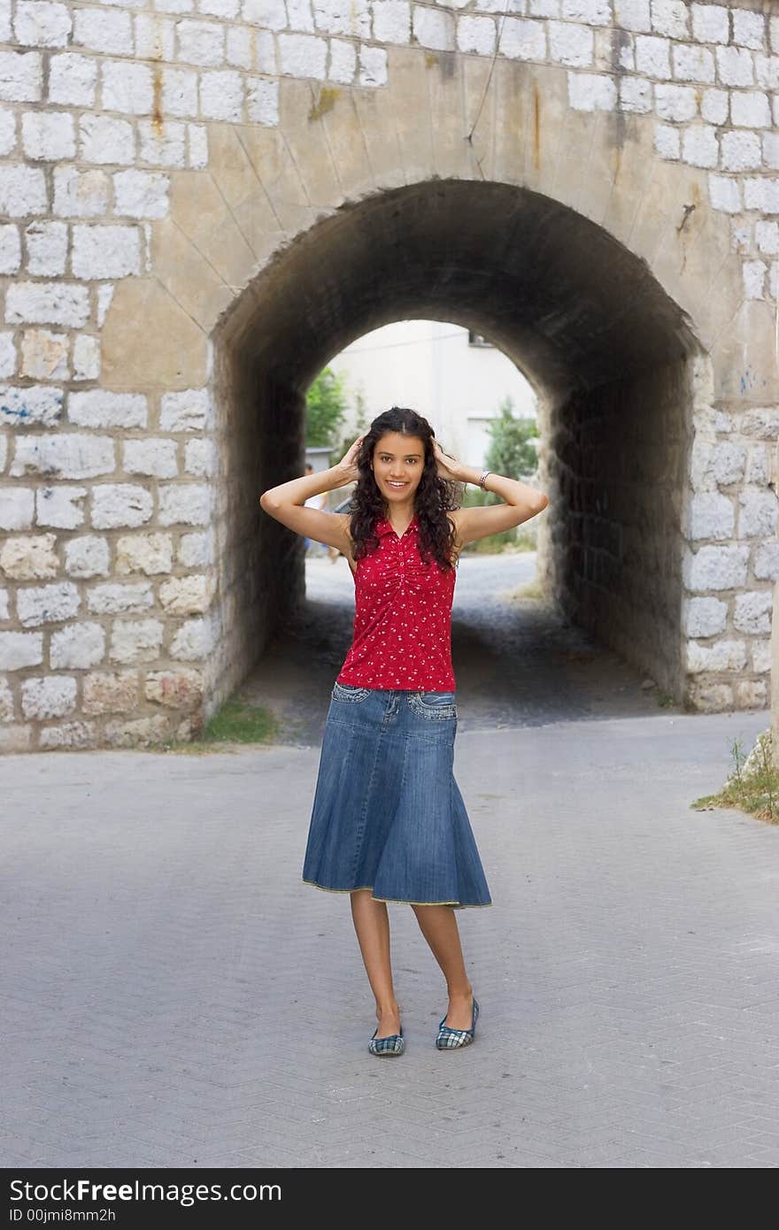 Beautiful smiling young woman in red. Beautiful smiling young woman in red