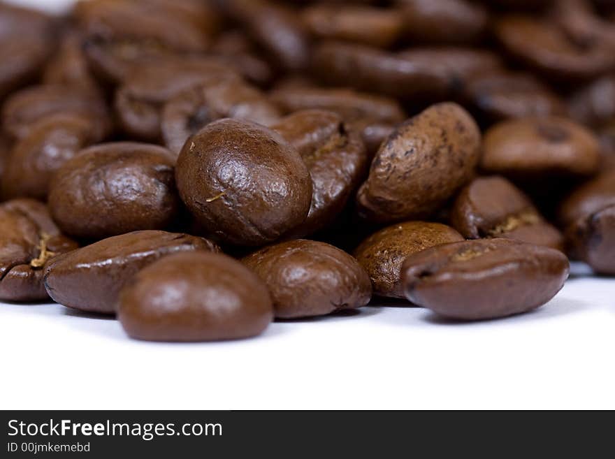 Coffee beans closeup on white background