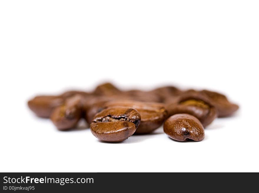 Coffee beans macro close up over white. Coffee beans macro close up over white