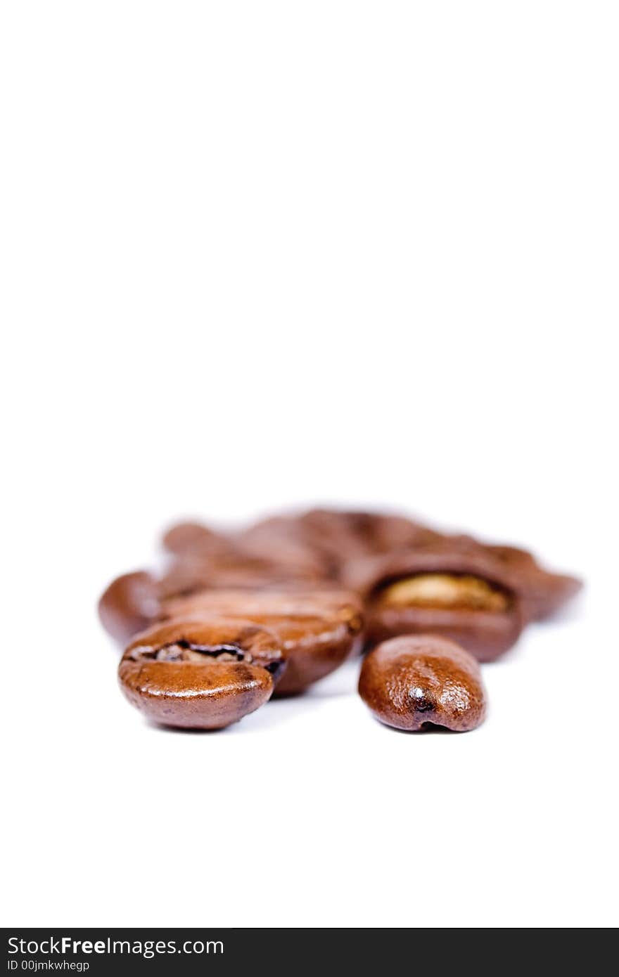 Coffee beans macro close up over white. Coffee beans macro close up over white