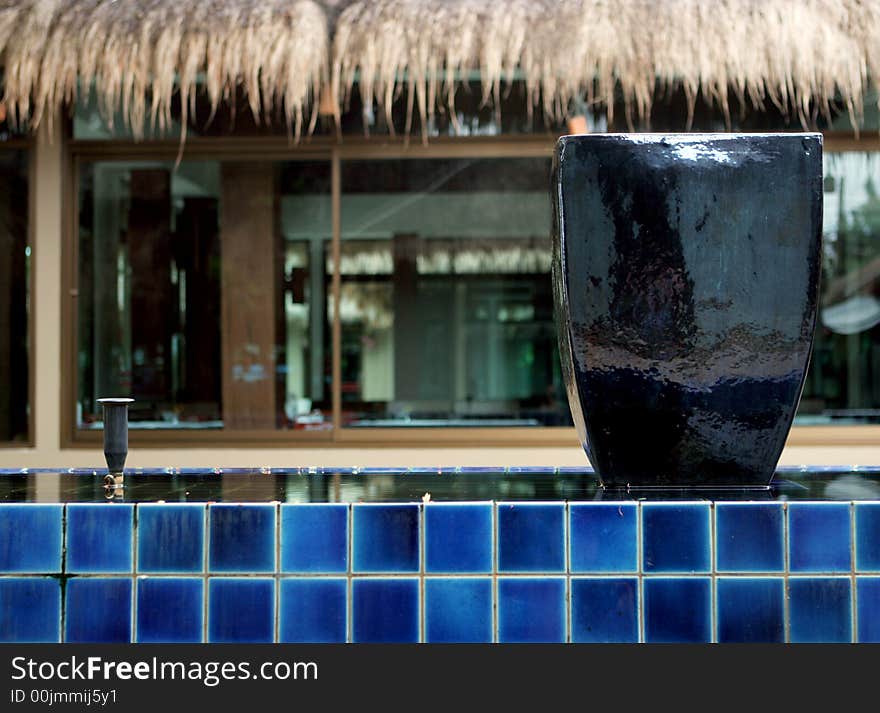 Blue ceramic pot in a water display.