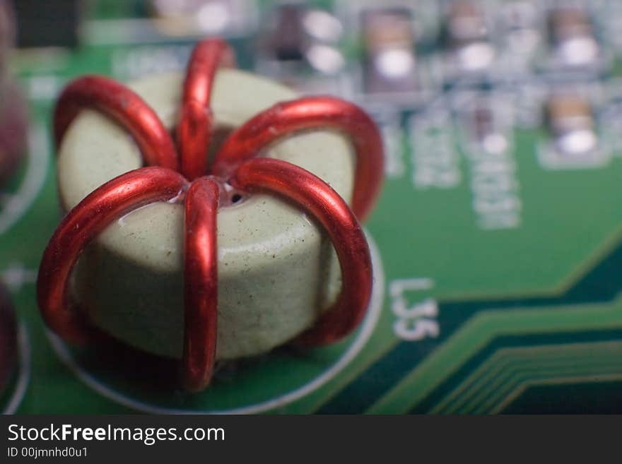 Motherboard's green electronic circuit - macro with shallow depth of field. Motherboard's green electronic circuit - macro with shallow depth of field