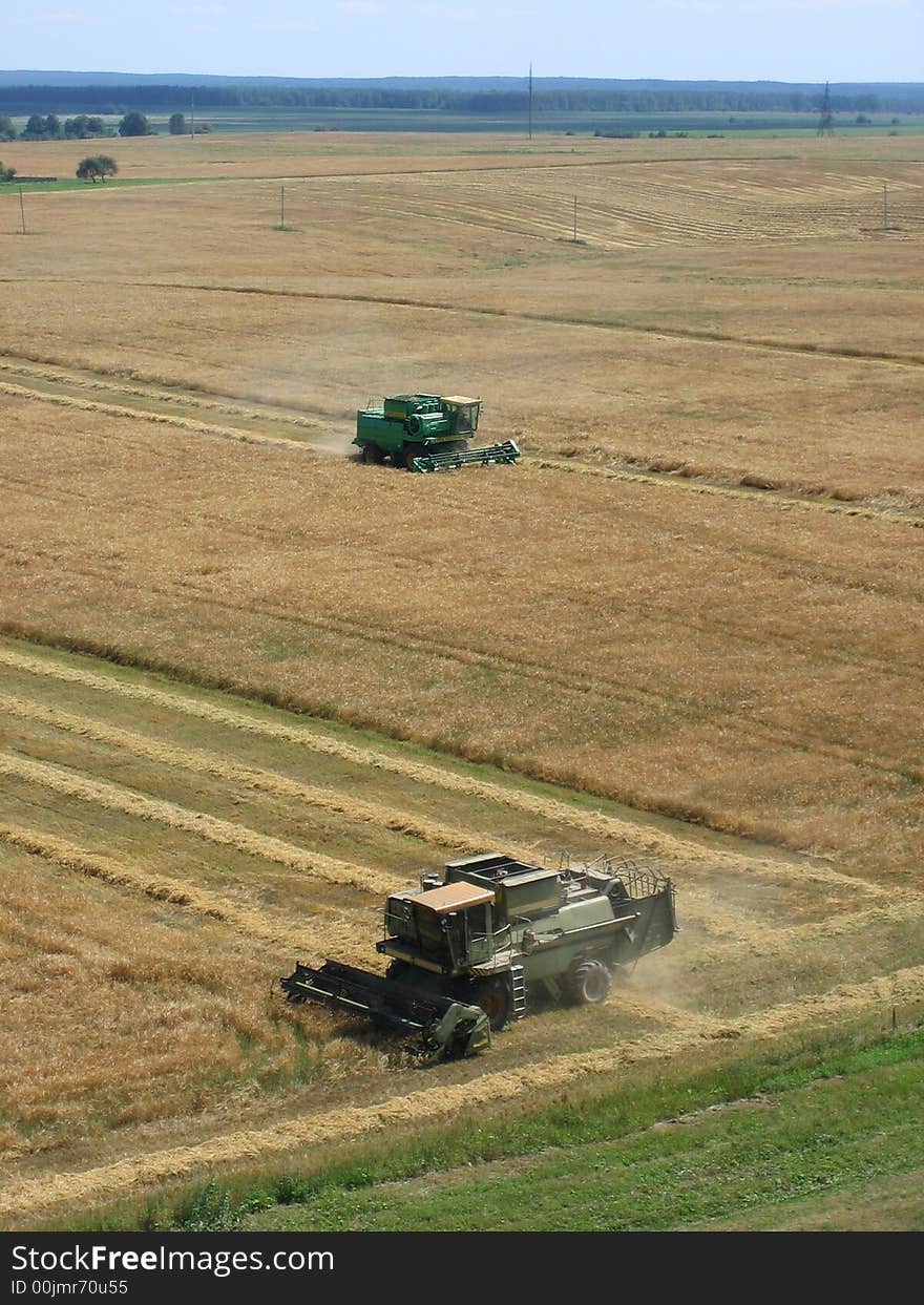 End of summer is busy time for farmers. This combine is reaping rye. End of summer is busy time for farmers. This combine is reaping rye.