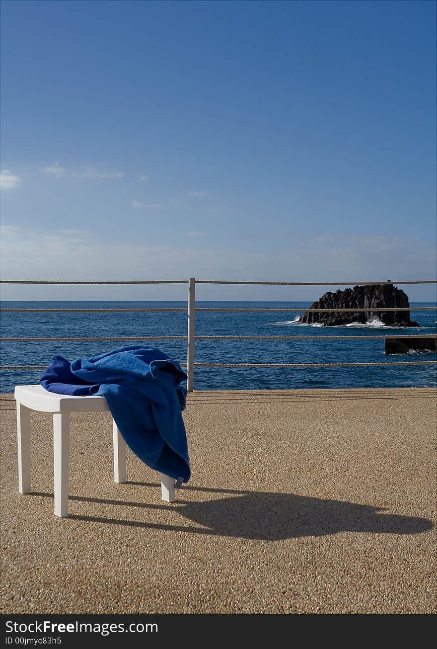 Sun, sea and chair with towel