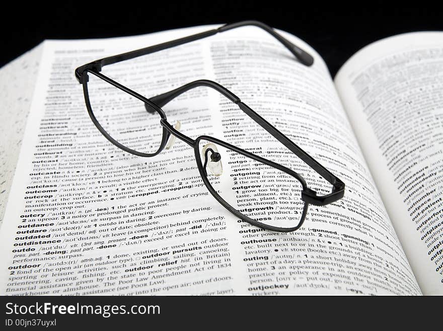 Spectacles on book