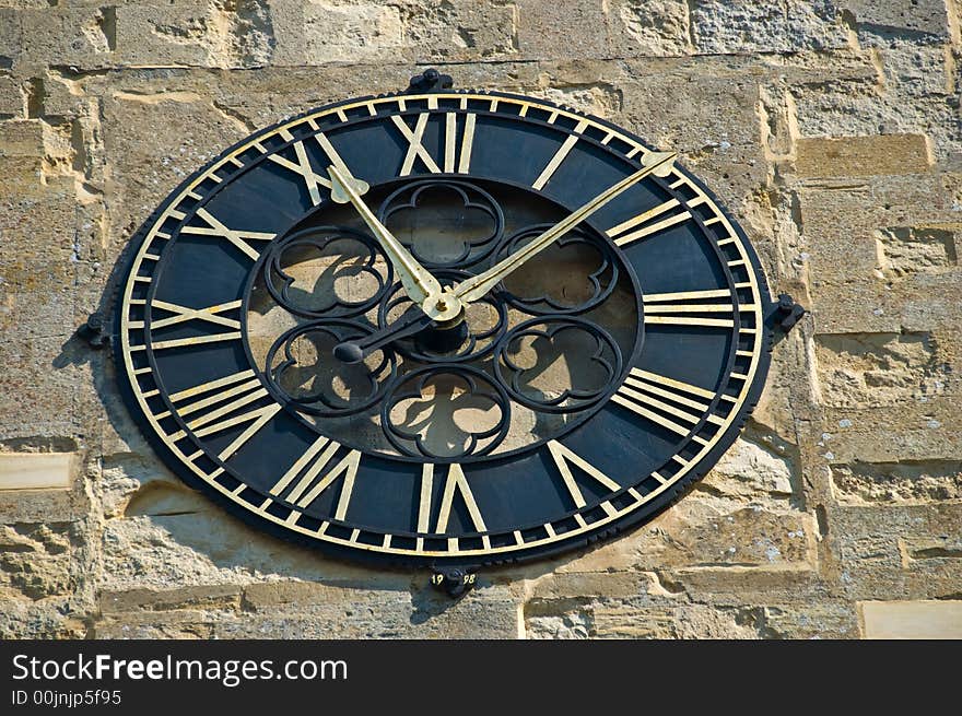 Ornate wall clock on public building. Ornate wall clock on public building