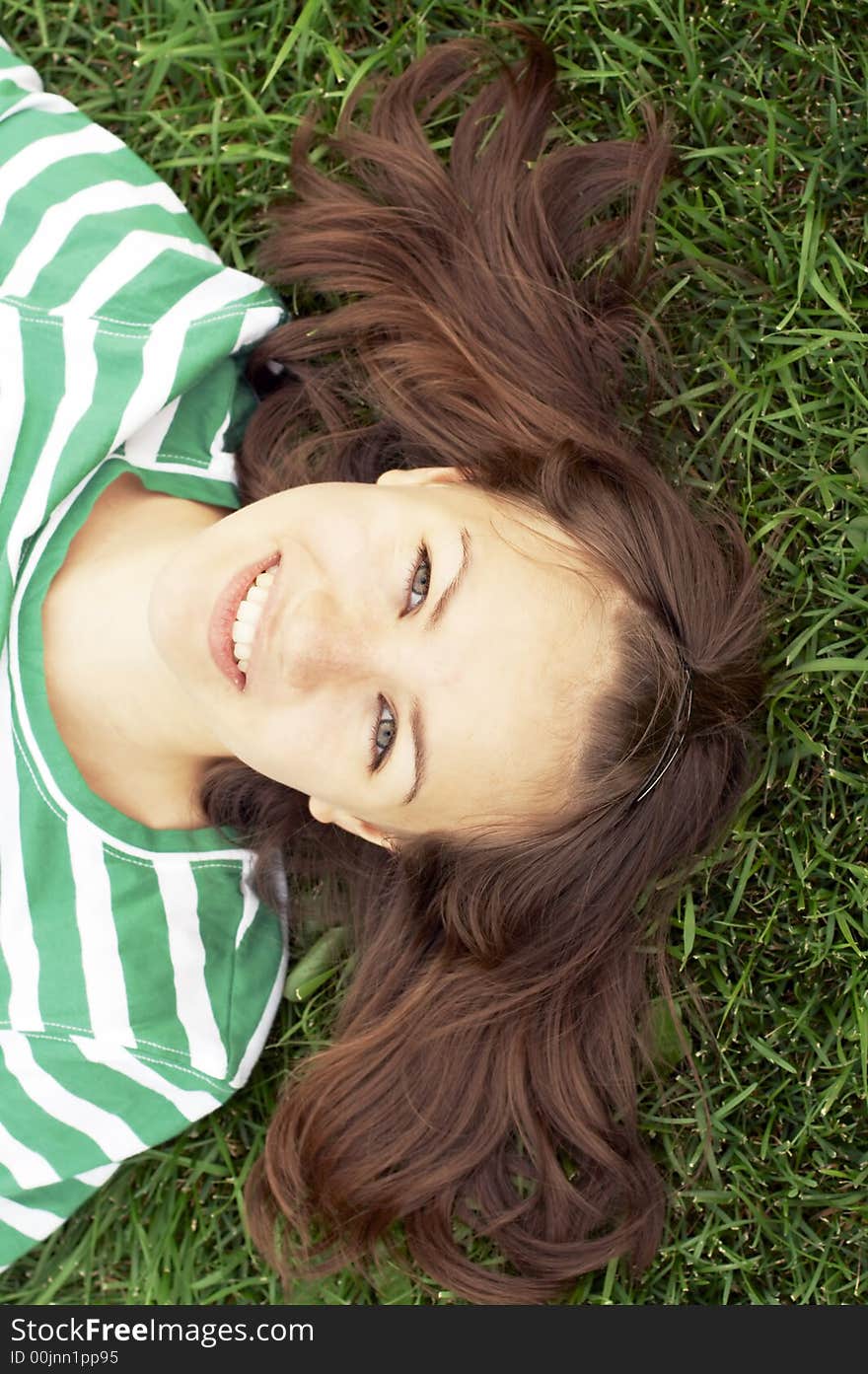 Girl lies on grass