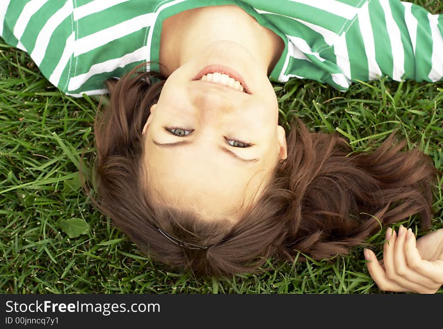 Girl lies on grass