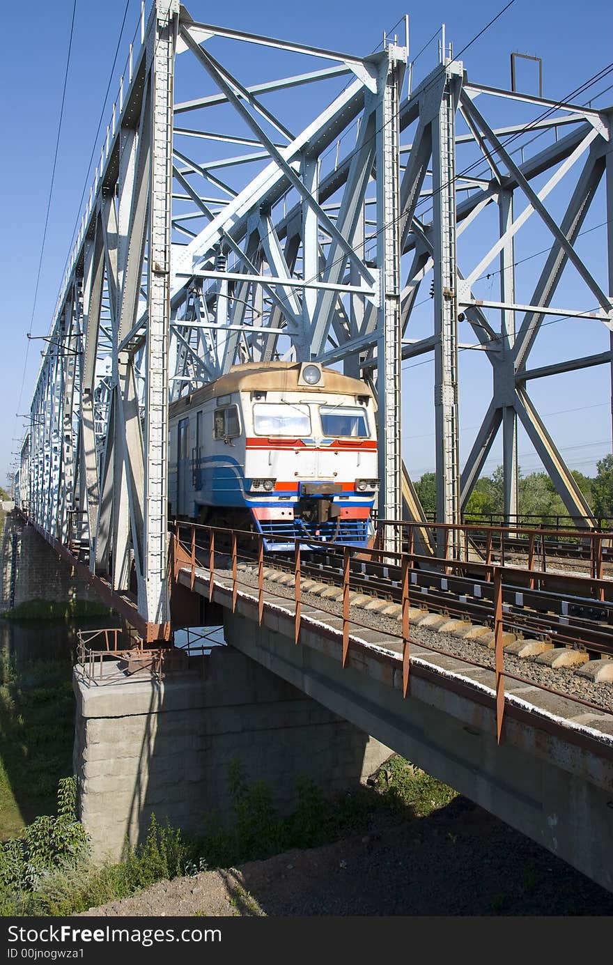 The locomotive the moving railway bridge through the river