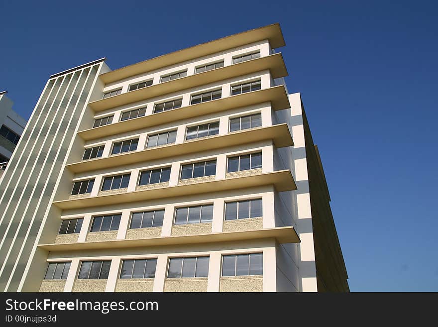 An old traditional apartment building against sky. An old traditional apartment building against sky