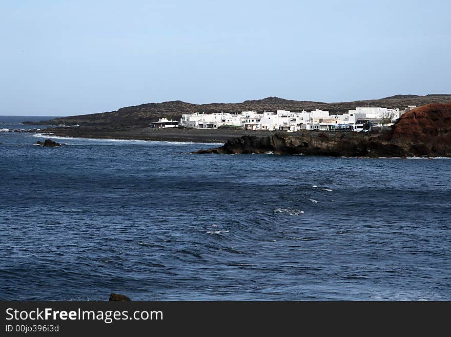 Fisherman village on a volcanic shore in canarias islands