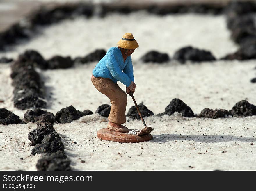 Worker in a salt field