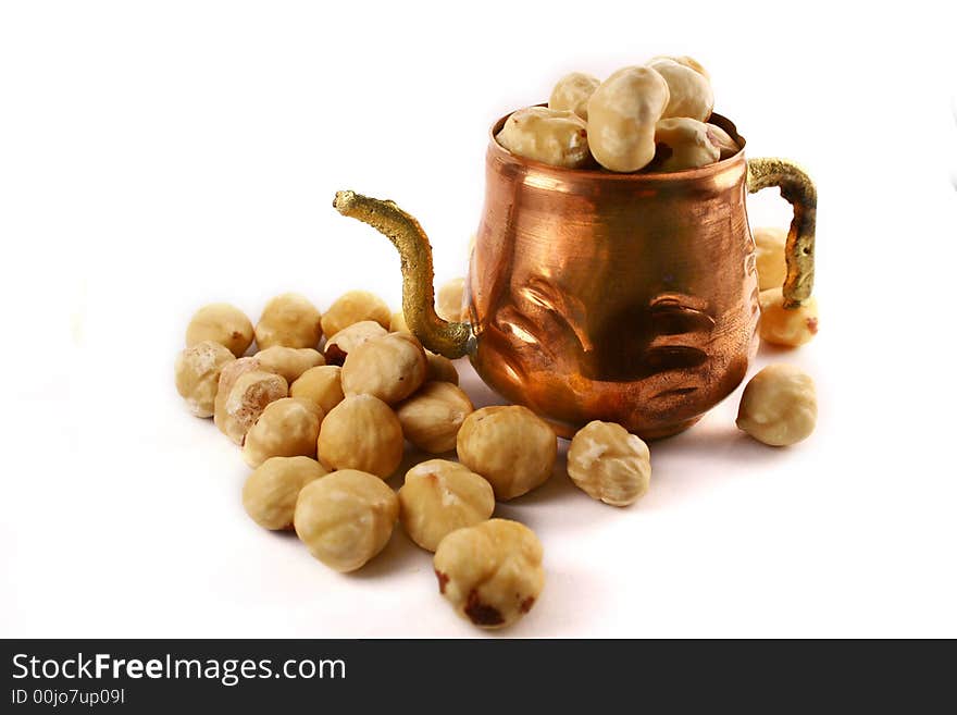 Hazelnuts amd cupper cup