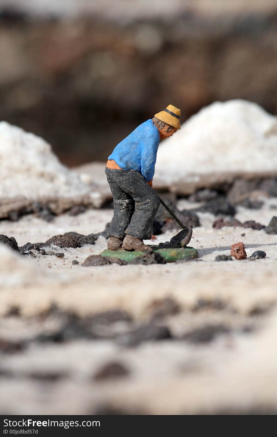 Worker in a salt harvest field