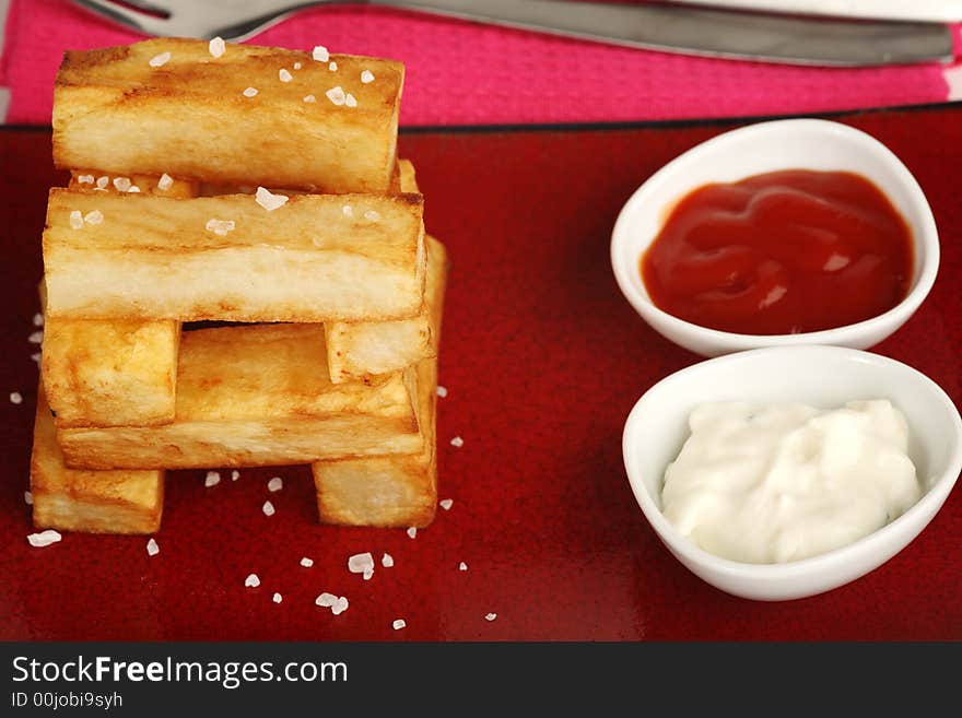 Thick cut golden chips stack like building blocks. Thick cut golden chips stack like building blocks