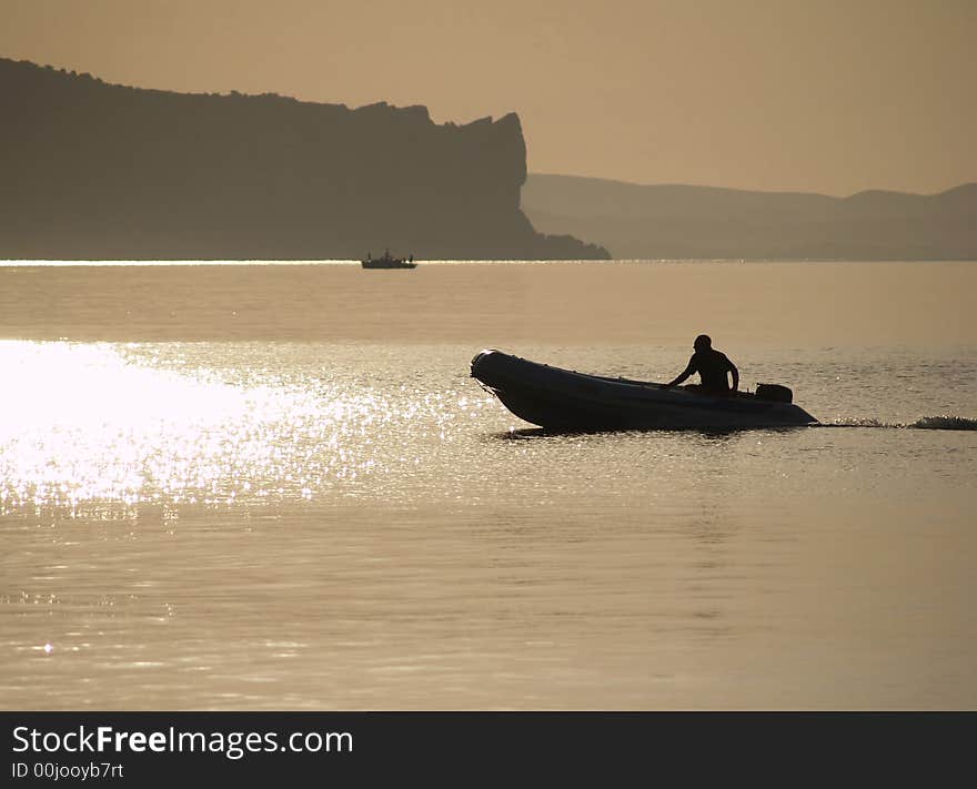 Boat flying in the rays of the morning sun. Boat flying in the rays of the morning sun