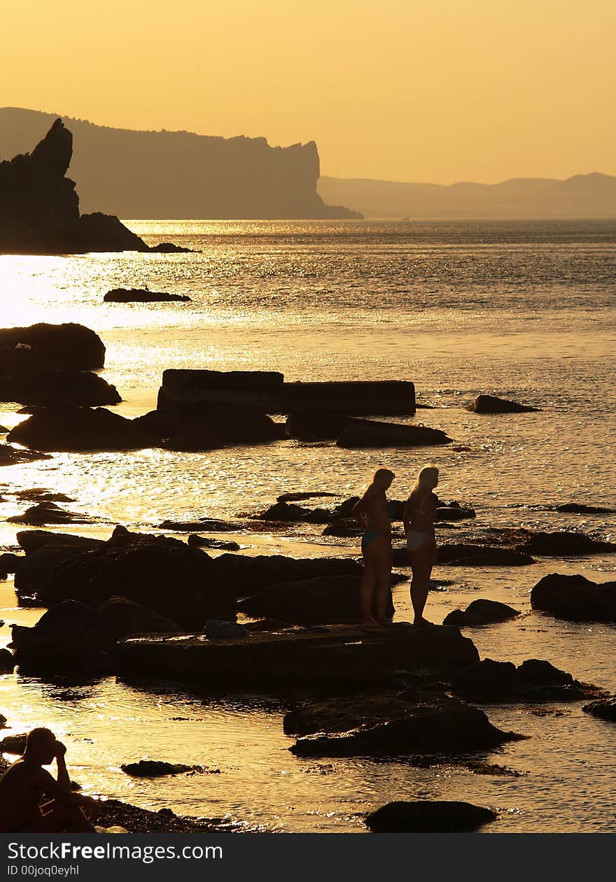 Silhouette image of  girls  on the beach. Silhouette image of  girls  on the beach