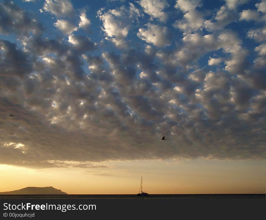 Small boat and sunset sky. Small boat and sunset sky