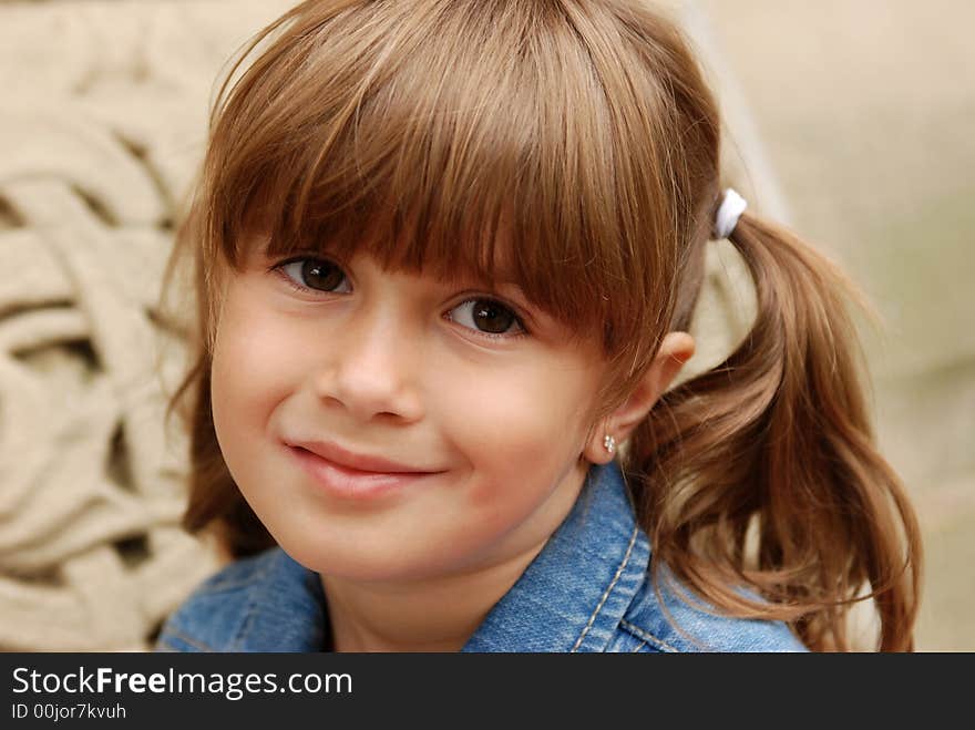 A portrait of a pretty young girl smiling. A portrait of a pretty young girl smiling