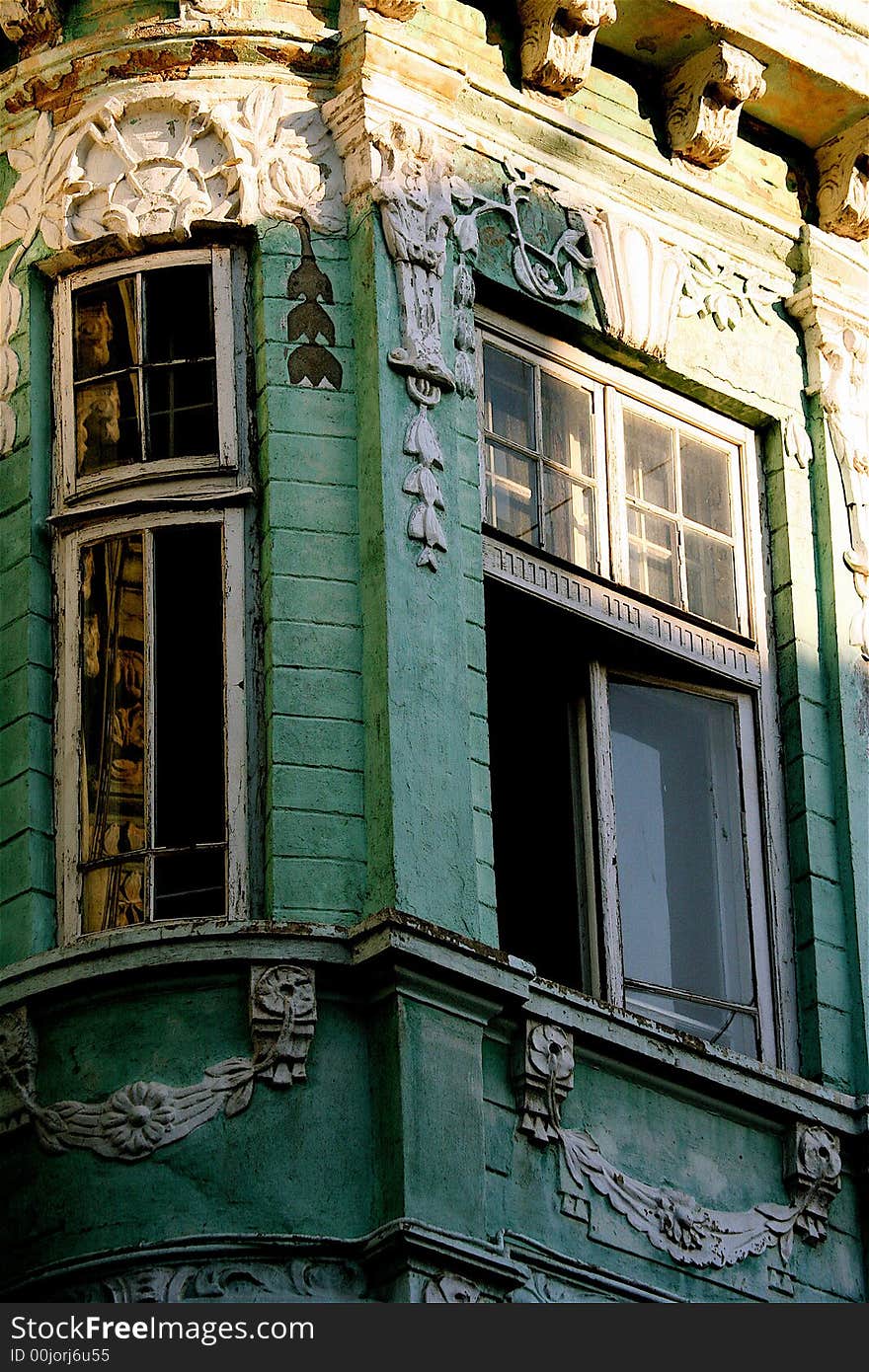 The corner and windows of an ancient masterpiece - the green house in barocco style. The corner and windows of an ancient masterpiece - the green house in barocco style