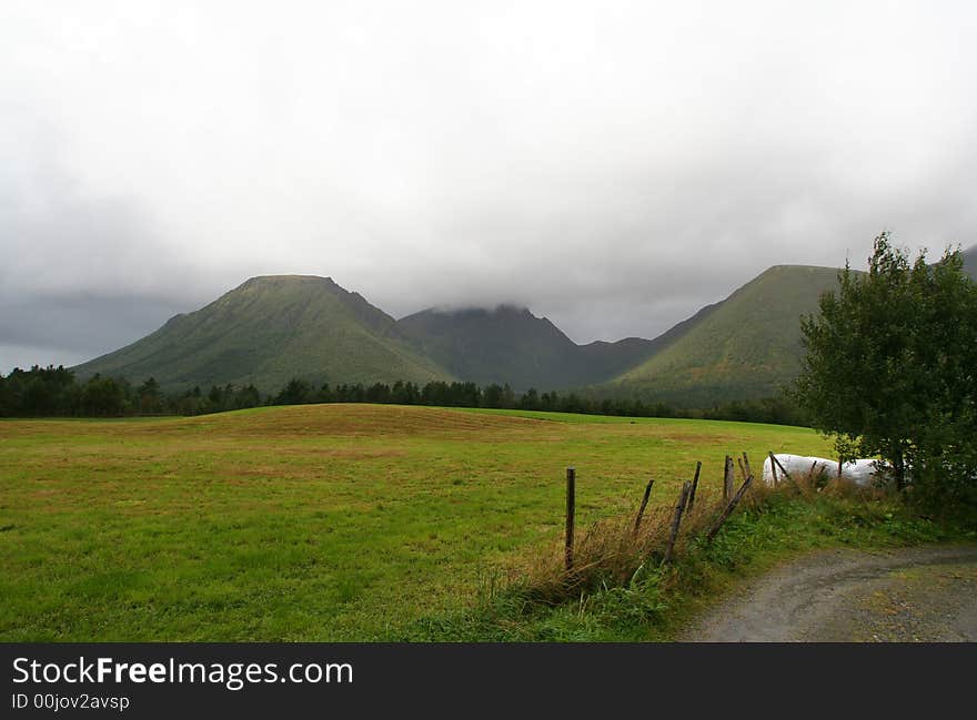 Rural norwegian landscape with mountains