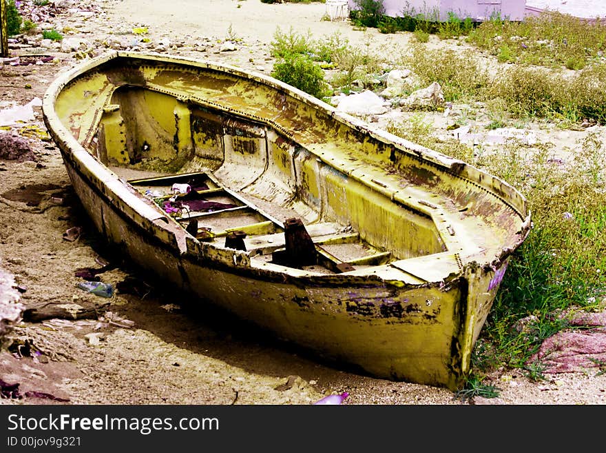 Old boat on old coast