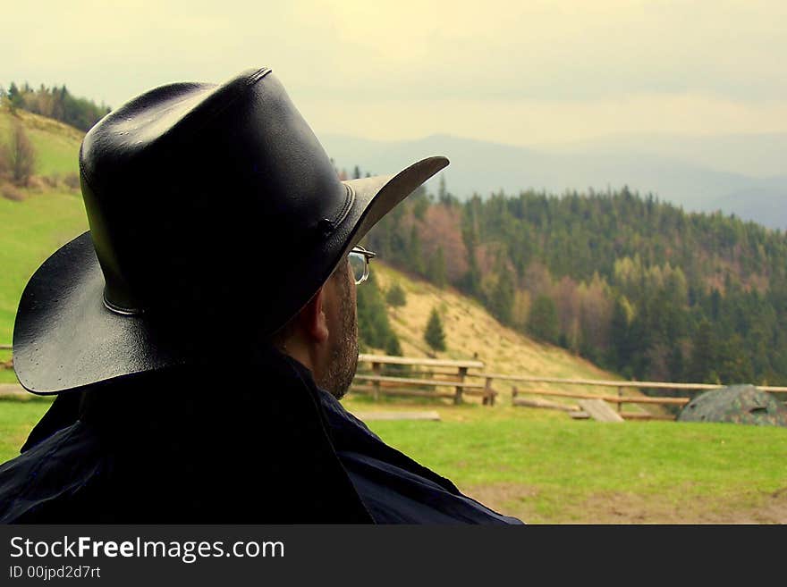 A man with black hat