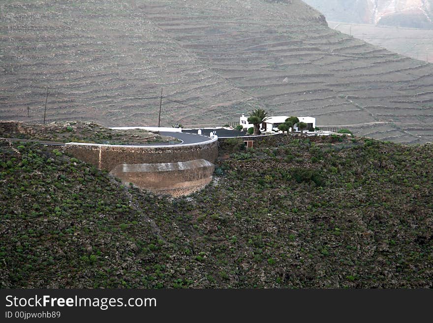 Steep road curve on top a hill. Steep road curve on top a hill