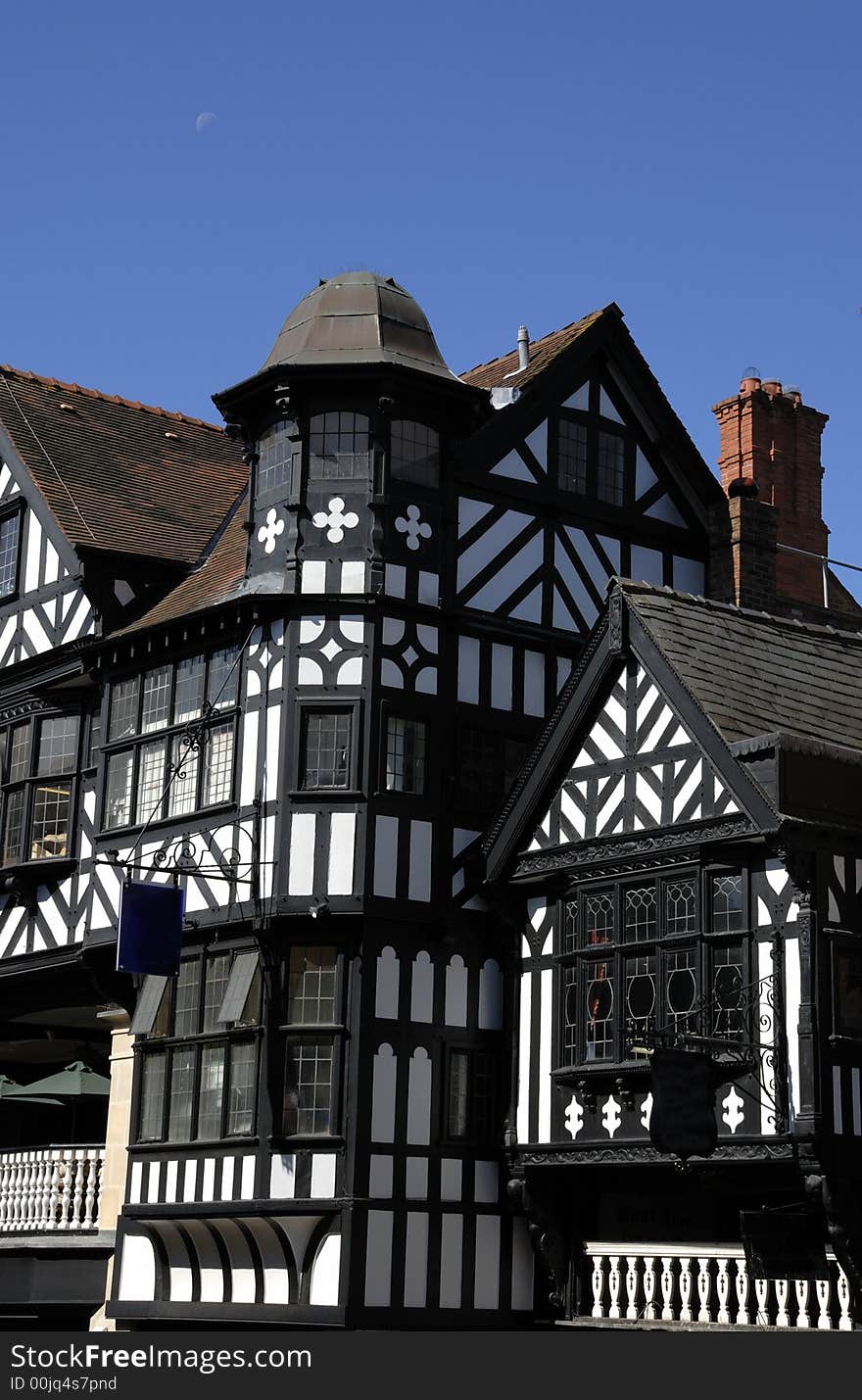 Old black and white tudor building in Chester England showing leaded windows and turret. Old black and white tudor building in Chester England showing leaded windows and turret.